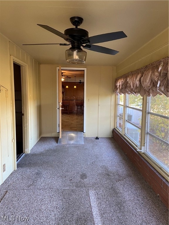 unfurnished room with ceiling fan