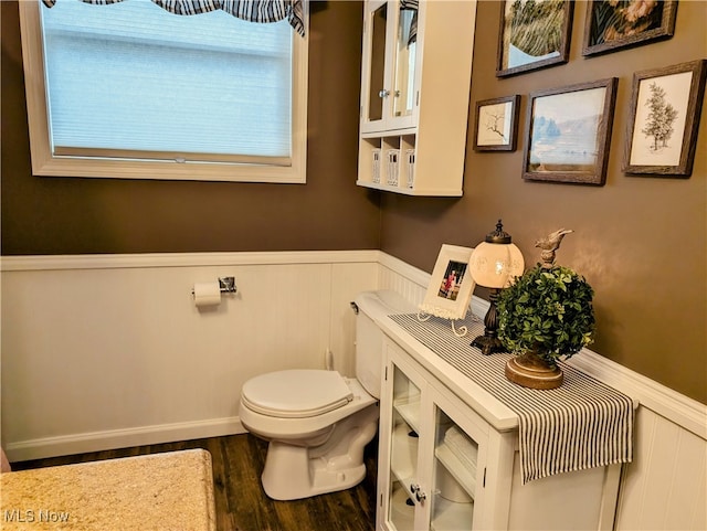 bathroom with toilet and wood-type flooring