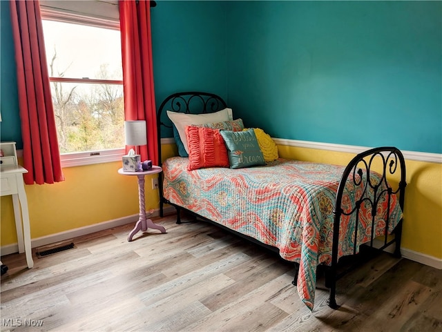 bedroom with light wood-type flooring