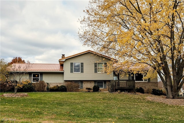 tri-level home with a front yard