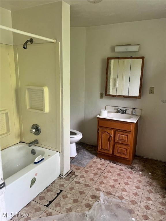 full bathroom with vanity, toilet, tile patterned floors, and  shower combination