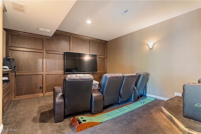 cinema room with visible vents, baseboards, and carpet floors