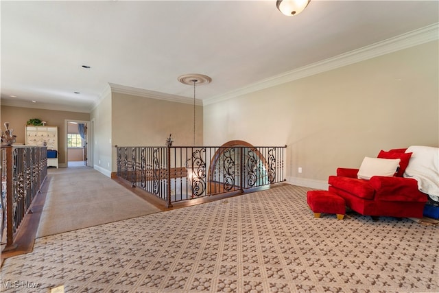 sitting room with light colored carpet and ornamental molding