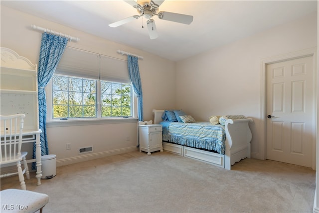 carpeted bedroom with ceiling fan