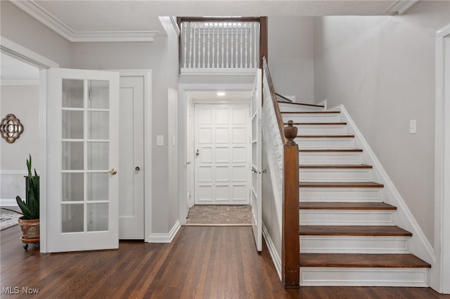 stairs with ornamental molding and wood-type flooring