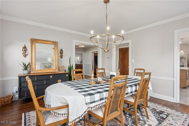 dining space with crown molding and dark wood-type flooring