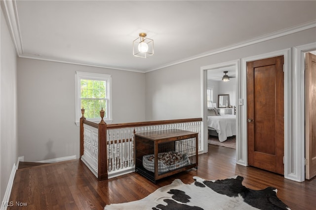 bedroom featuring ornamental molding and dark hardwood / wood-style floors