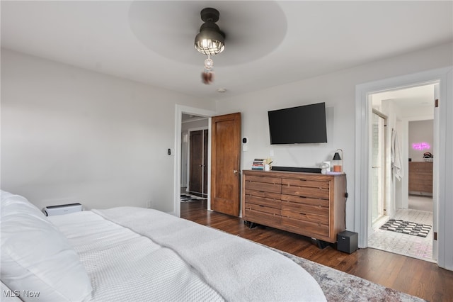 bedroom with dark hardwood / wood-style flooring