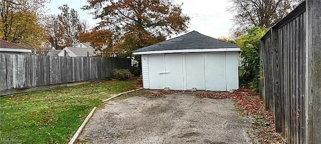 view of outdoor structure with a lawn