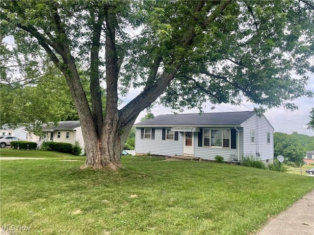 ranch-style home with a front lawn