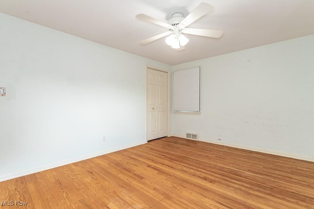 unfurnished room featuring light hardwood / wood-style flooring and ceiling fan