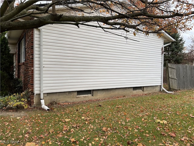 view of home's exterior featuring a lawn