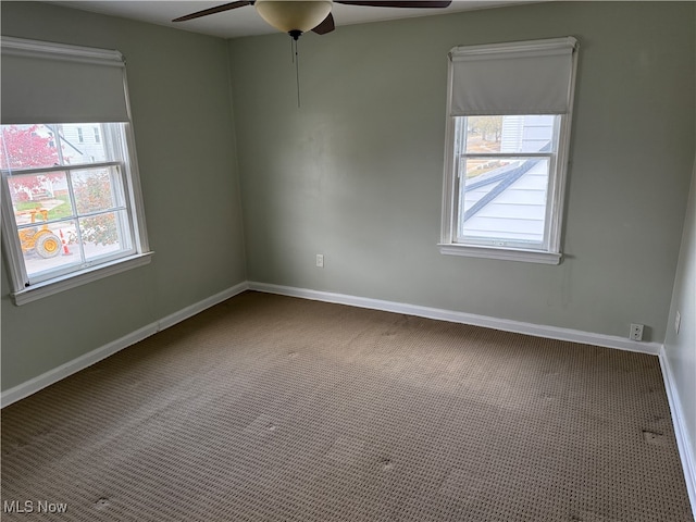 empty room featuring carpet and ceiling fan