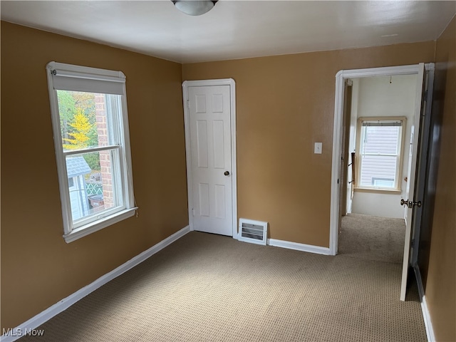 unfurnished bedroom with carpet floors