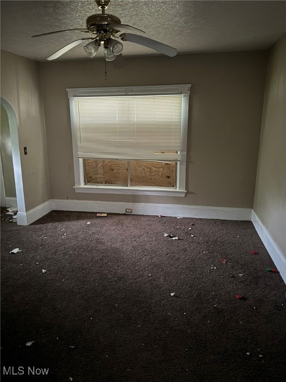 unfurnished room with carpet, a textured ceiling, and ceiling fan