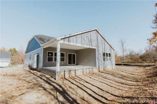 back of house featuring central AC