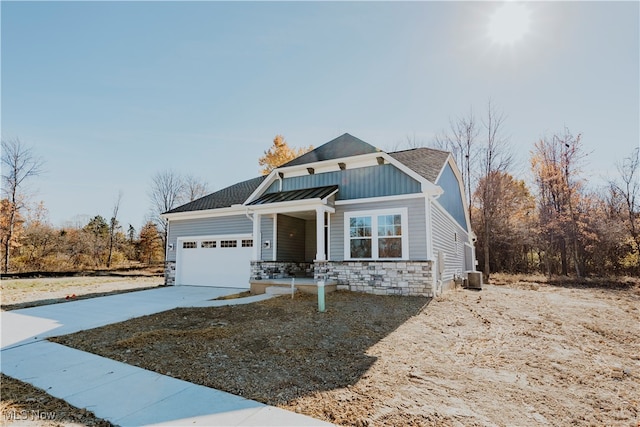 craftsman house with a porch and a garage