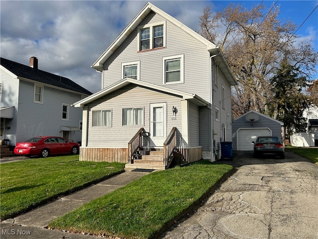 front of property with a front lawn, a garage, and an outdoor structure