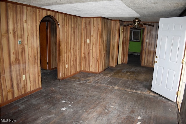 spare room with a textured ceiling and ceiling fan