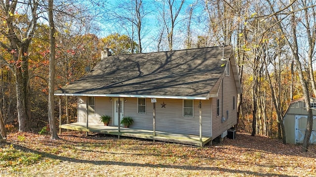 view of property exterior featuring a storage unit