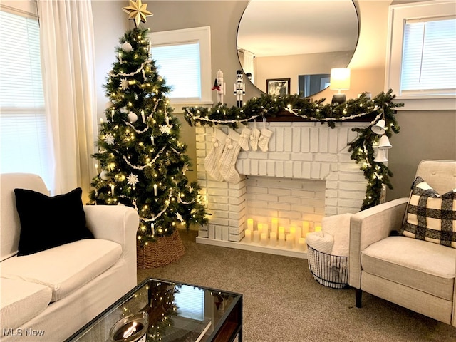 carpeted living room with a fireplace