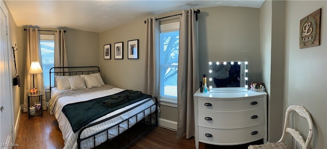 bedroom featuring dark wood-type flooring