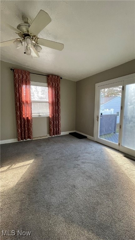 unfurnished room featuring carpet flooring and ceiling fan