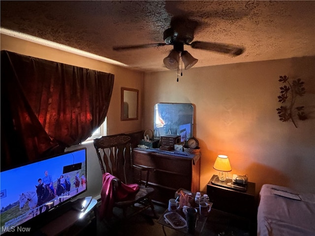 office space featuring a textured ceiling and ceiling fan