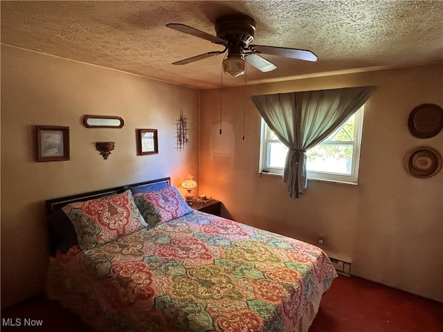 bedroom with ceiling fan, a textured ceiling, and baseboard heating