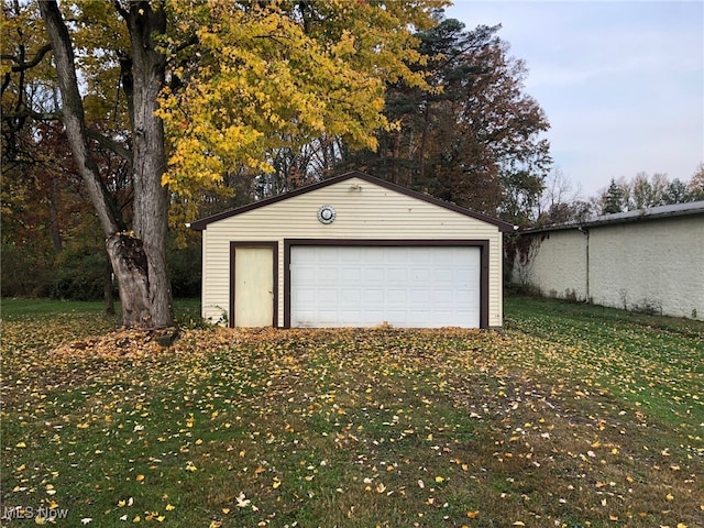 garage featuring a yard