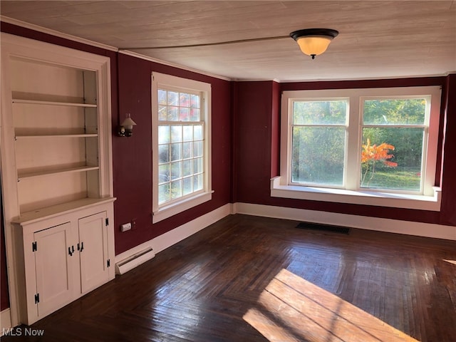 unfurnished dining area with crown molding, dark parquet floors, and a baseboard radiator