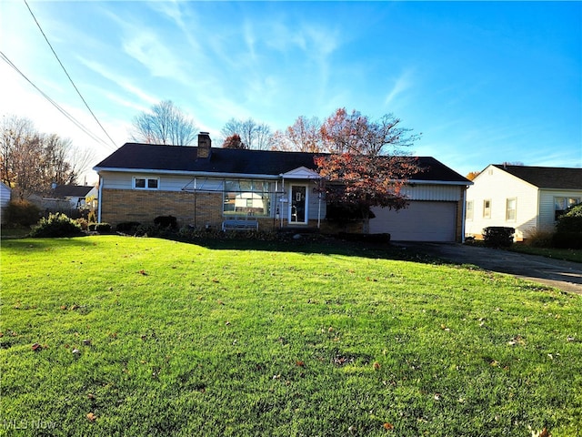 ranch-style house with a front yard and a garage