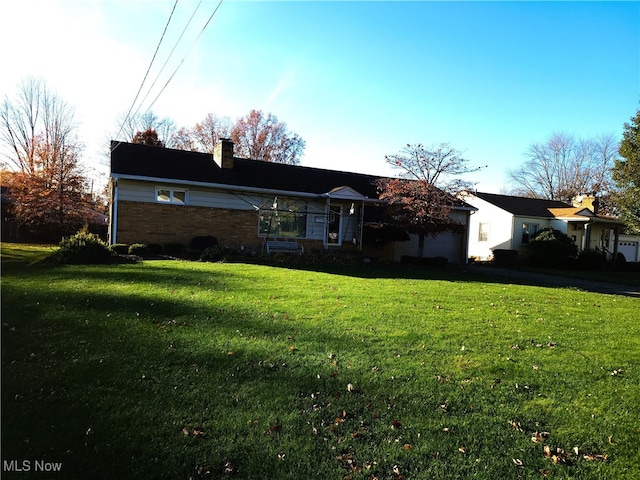 view of front of home with a front lawn