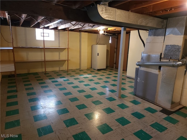 basement with heating unit and water heater