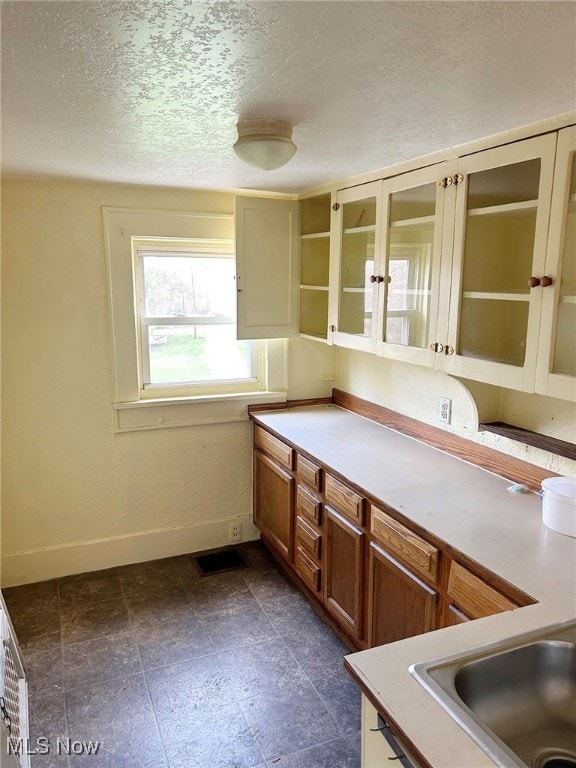 kitchen featuring a textured ceiling