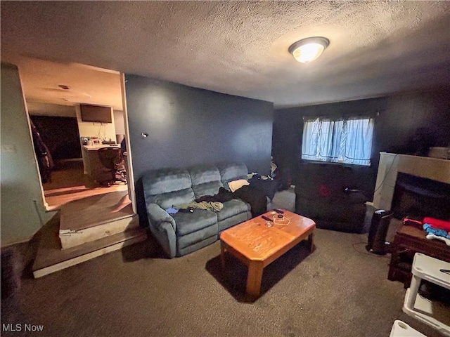 carpeted living room with a textured ceiling