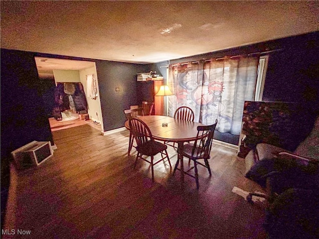 dining area featuring a textured ceiling