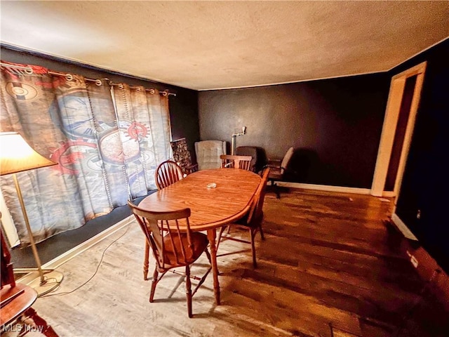 dining space featuring hardwood / wood-style floors