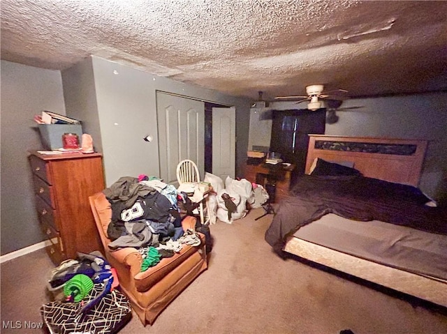 bedroom with carpet, a textured ceiling, a closet, and ceiling fan