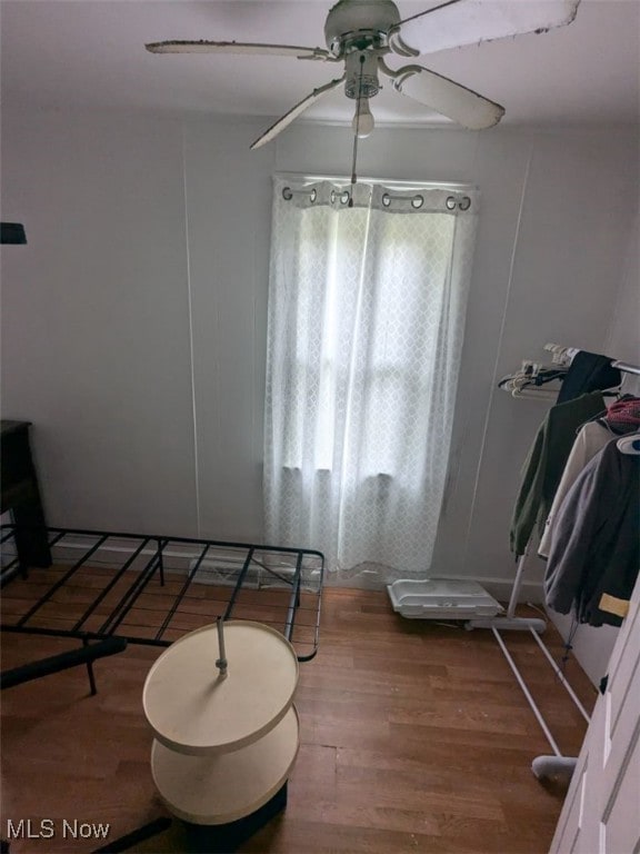 bathroom with ceiling fan, toilet, and hardwood / wood-style floors