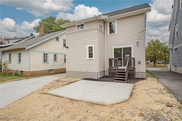 back of house with a patio area