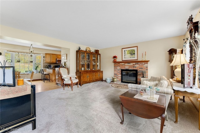 carpeted living room with a fireplace