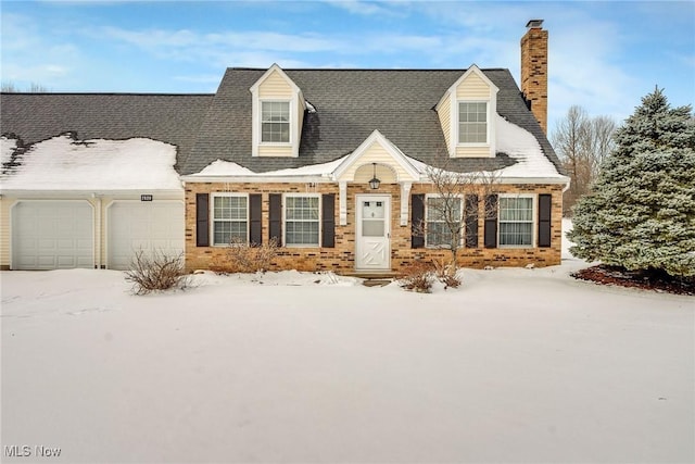 cape cod home featuring a garage