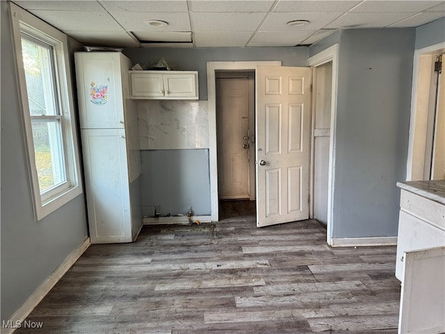 kitchen featuring light hardwood / wood-style floors and a paneled ceiling