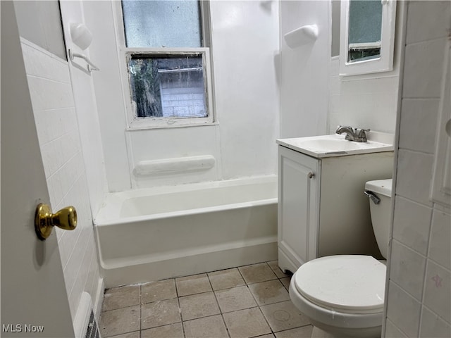 full bathroom featuring toilet, shower / washtub combination, vanity, and tile patterned floors