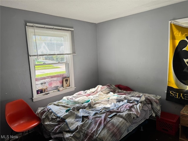 bedroom featuring a textured ceiling