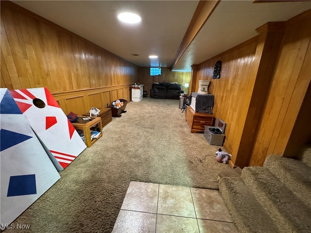 interior space featuring wooden walls and carpet