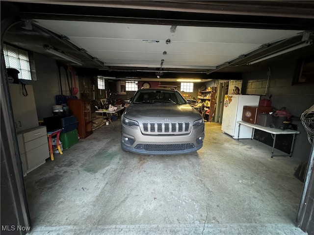 garage with white refrigerator