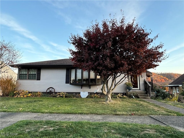 view of property exterior featuring a lawn