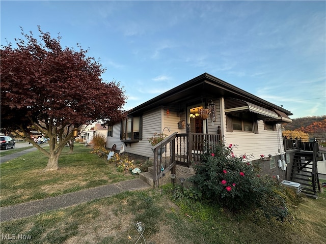 bungalow-style house with a front lawn